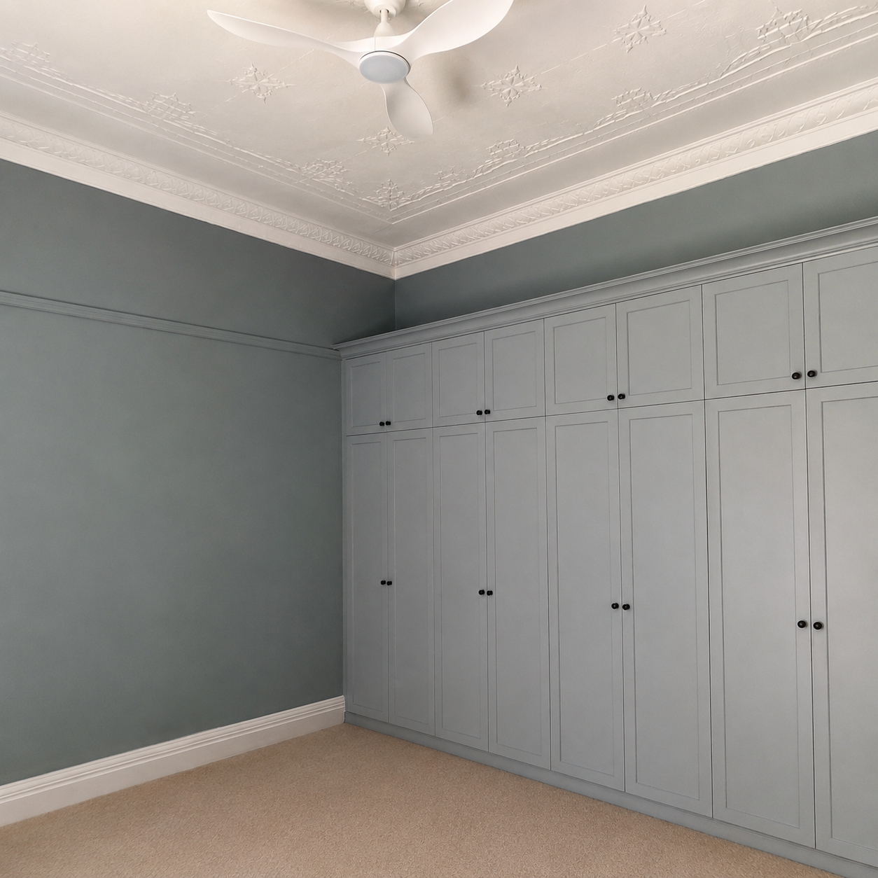 Custom grey shaker wardrobes in heritage bedroom at Roachdale