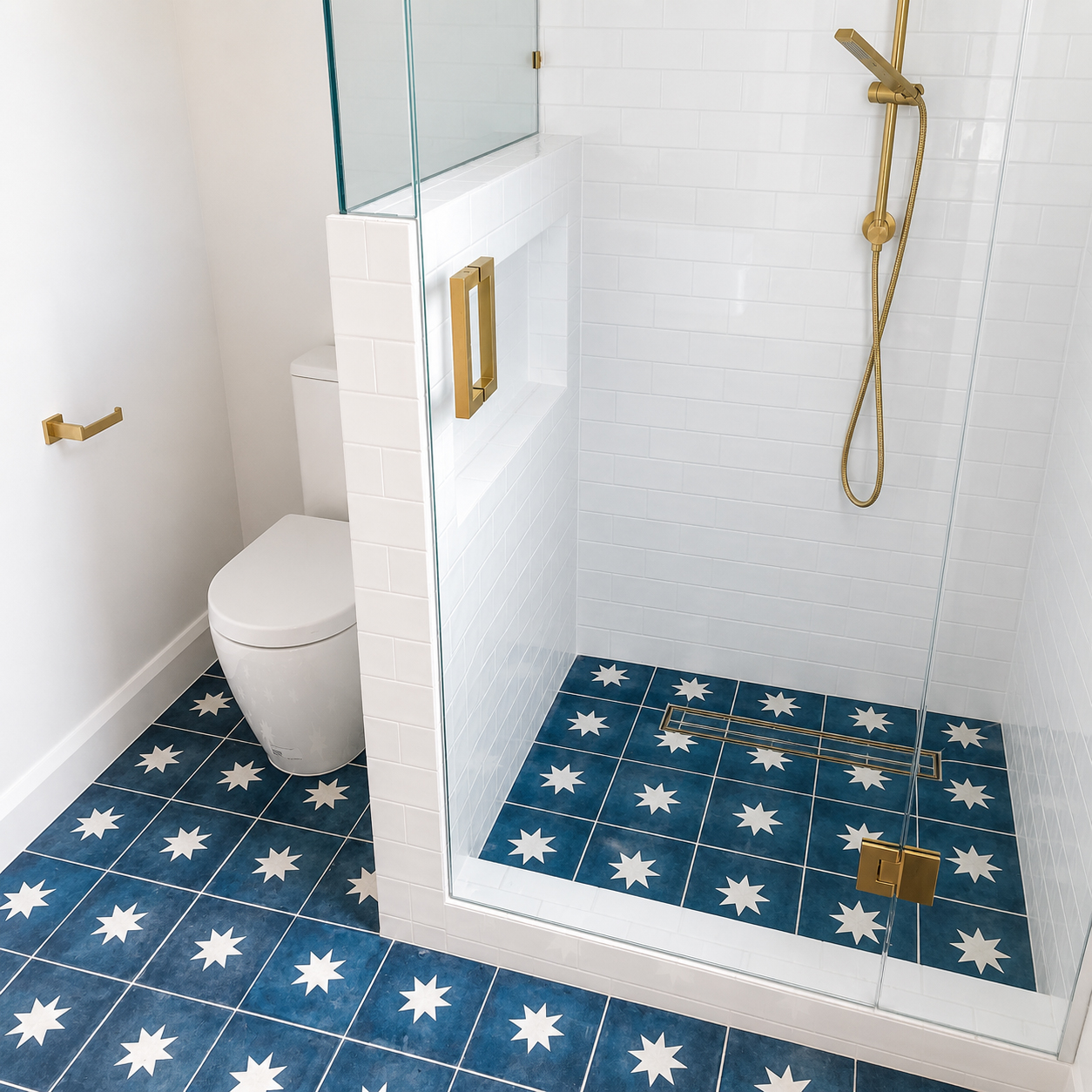 Feature bathroom with blue star-pattern floor tiles and brass tapware at Roachdale