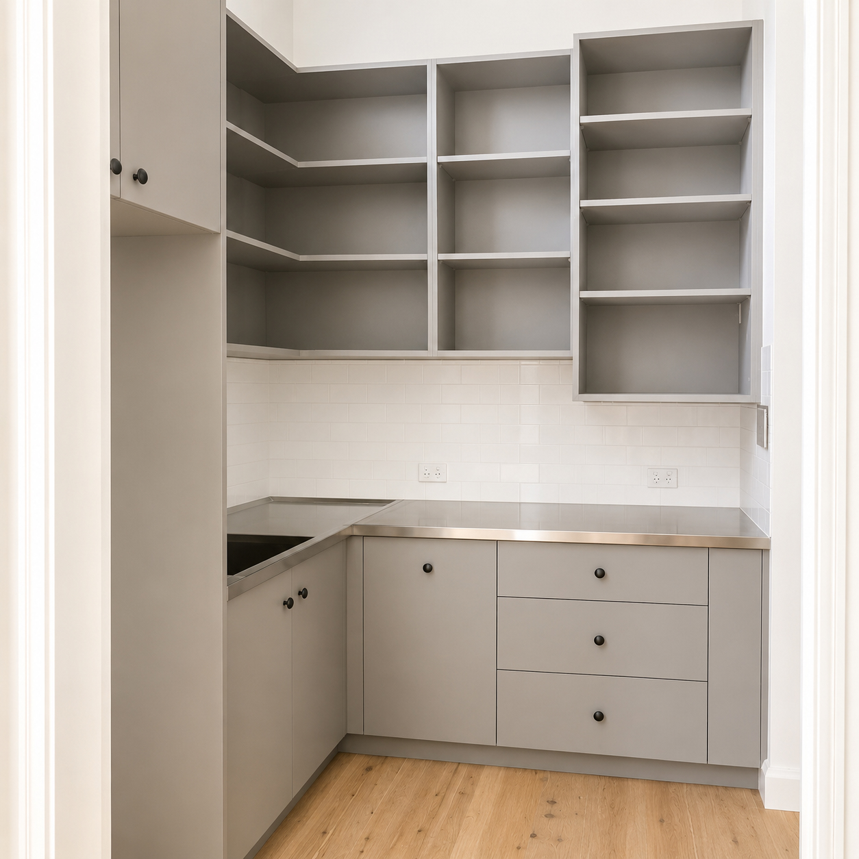 Custom butler's pantry with shaker cabinetry and stainless steel benchtops at Roachdale