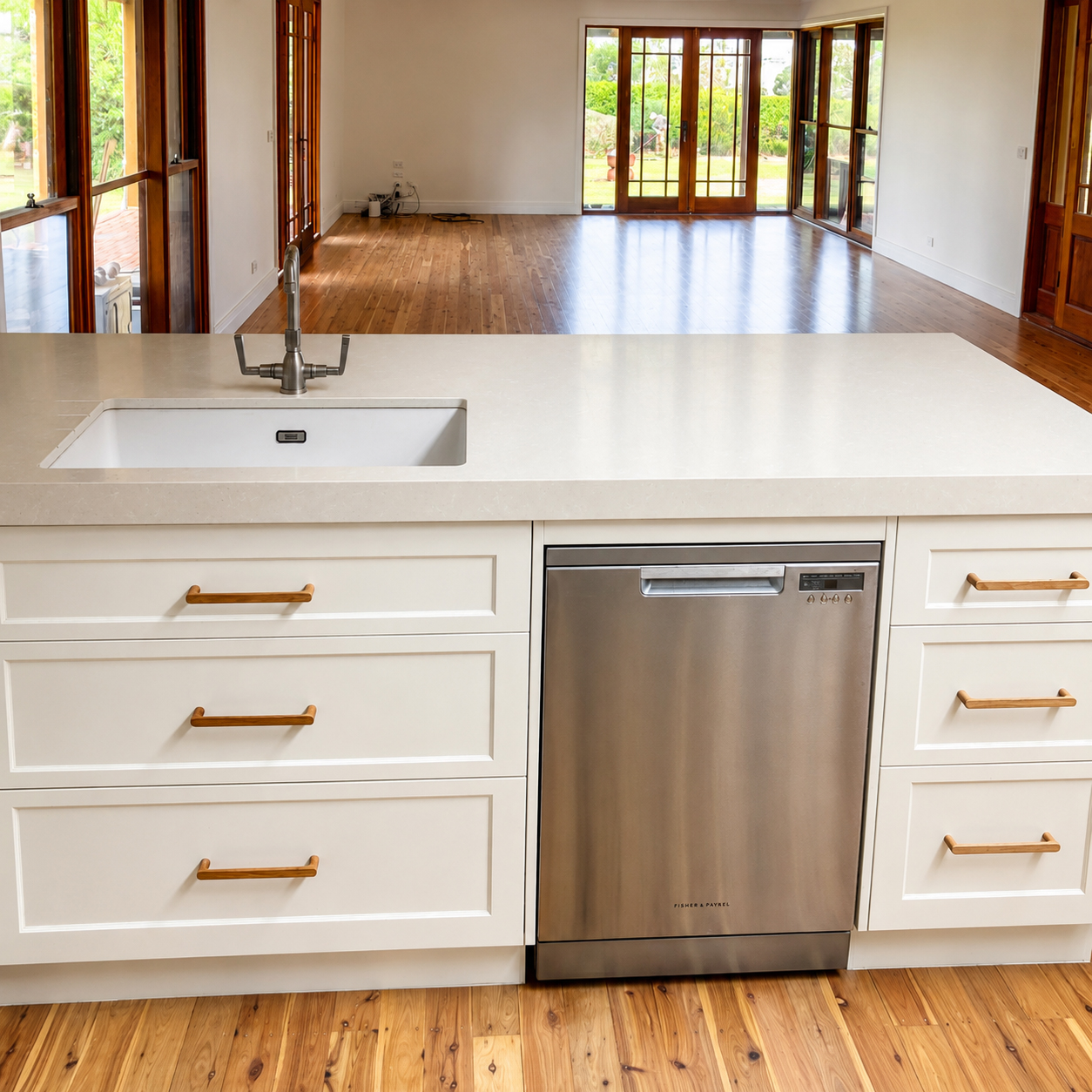 Custom kitchen island with integrated sink, stone benchtop and quality cabinetry
