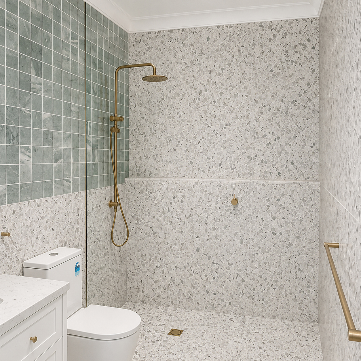 Terrazzo tiled walk-in shower with brass fixtures in renovated heritage farmhouse bathroom