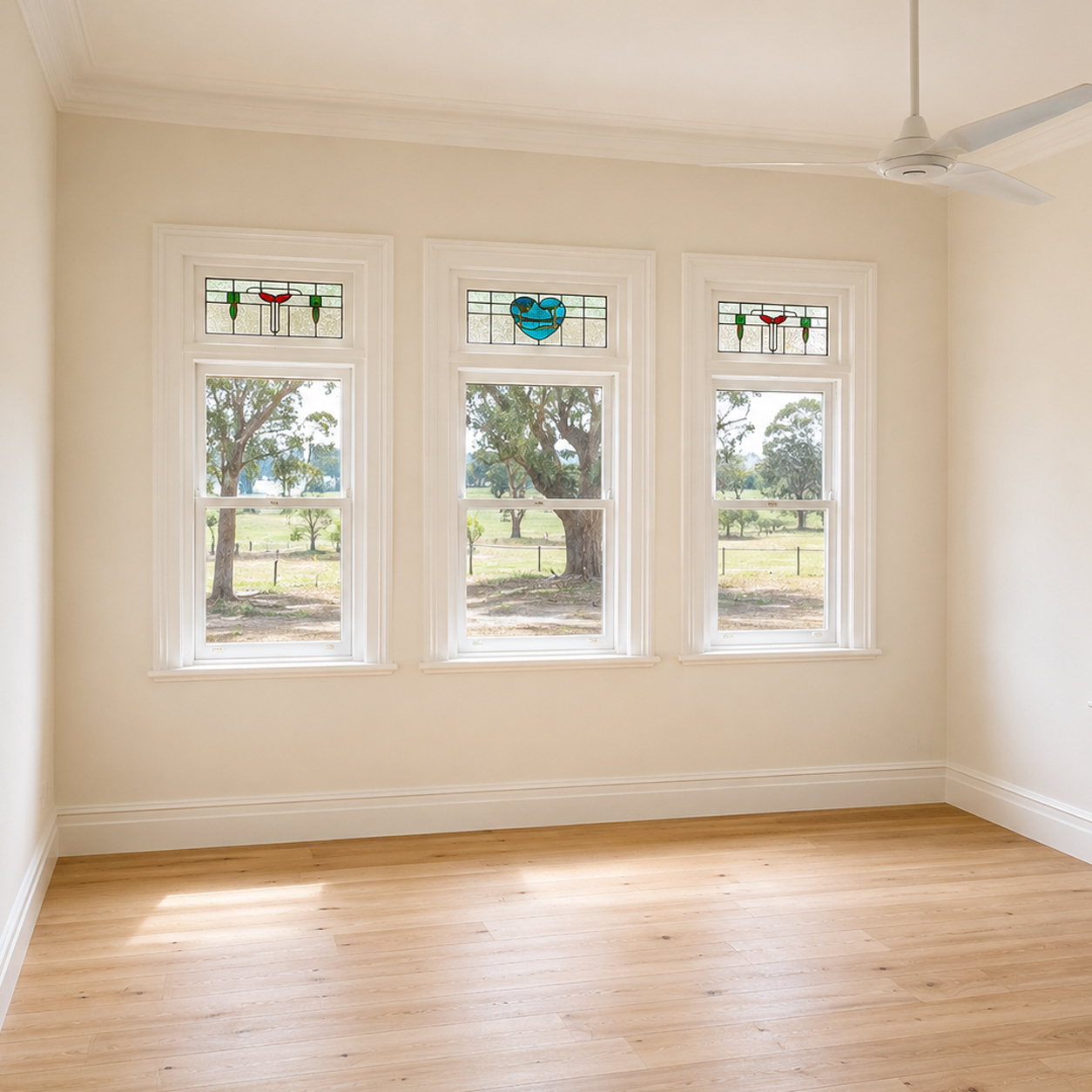 Restored heritage room with original stained glass windows and polished timber flooring