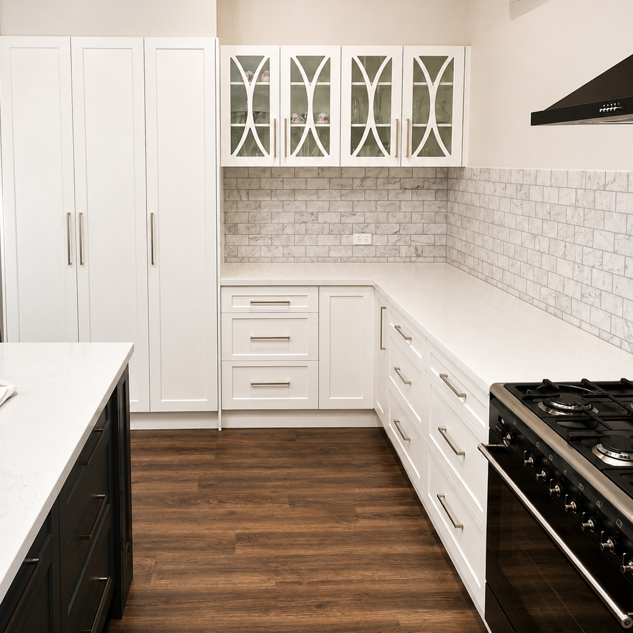 Bespoke white kitchen cabinetry with marble splashback and large pantry at Woomargama renovation