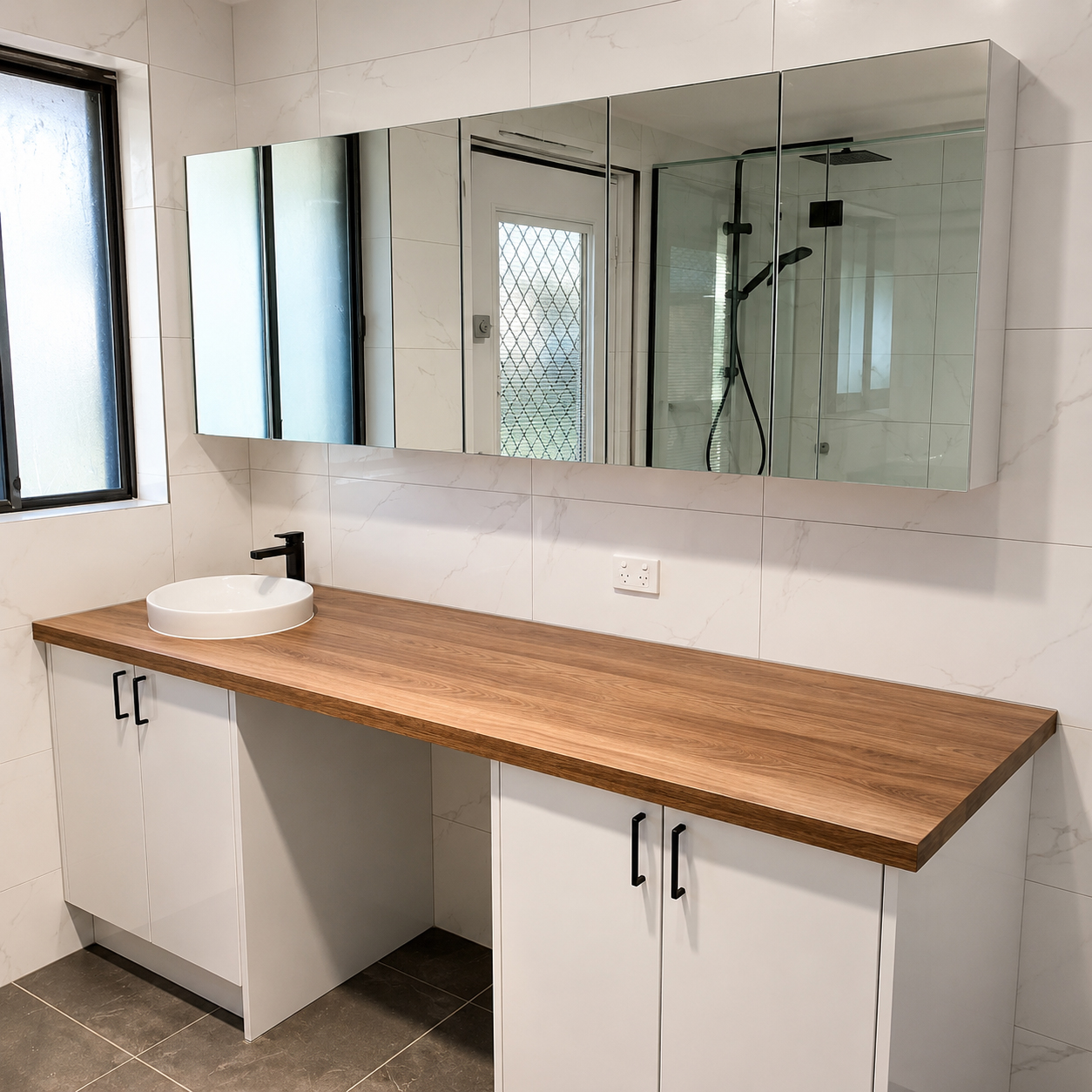 Bathroom vanity renovation with timber cabinetry and mirror