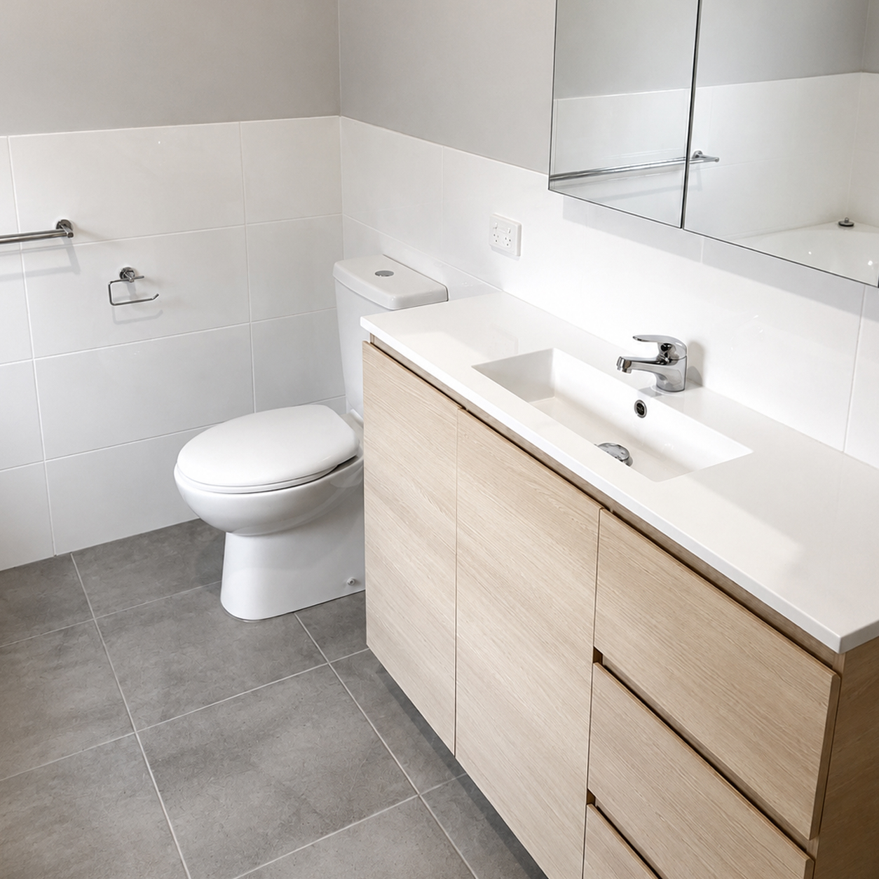Custom bathroom vanity with stone benchtop and timber cabinetry