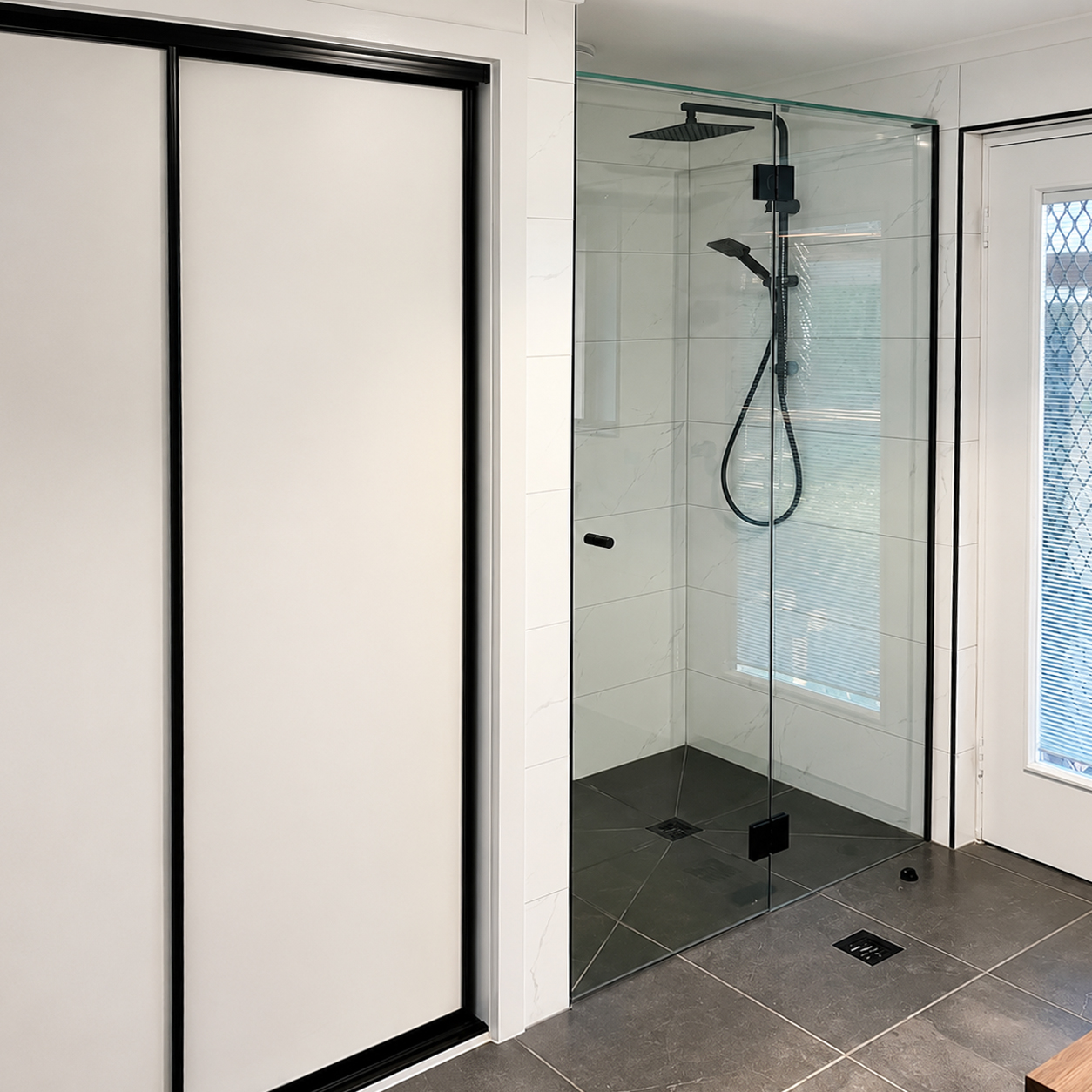 Walk-in shower renovation with frameless glass shower screen